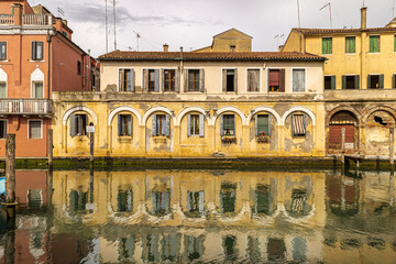 construction reflected in the canals of Chioggia