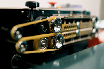 Obraz premium conveyor belt of the work process of the packaging machine the warehouse for the production of roasted coffee for sale