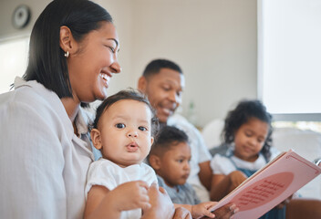 Theyre the best story tellers. Shot of a young family happily bonding together on the sofa at home.