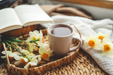 Cup of hot tea and spring home interior. good morning concept