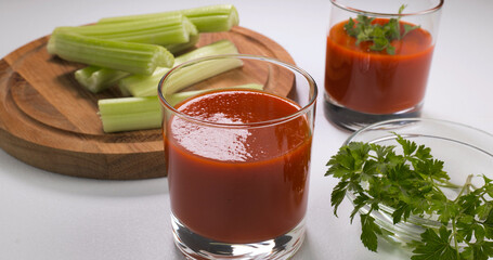 Glasses of tomato juice on the table