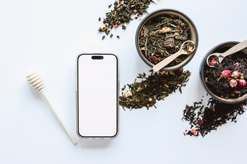 Isolated screen phone and tea assortment