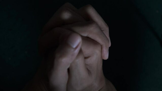restless male hands praying. nervous and uncomfortable. Nervous hands. The man is nervous, praying. christian man hand pray. 4K video footage.