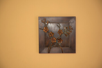 Art metal bronze creation on the wall.