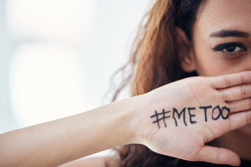 Lets all stand up against sexual abuse. Closeup shot of a young woman with the hashtag me too written on her hand. - Powered by Adobe
