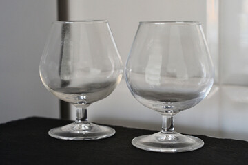 Two glasses on a black and white background