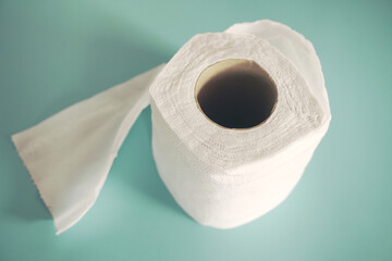Simple toilet paper on blue background.
