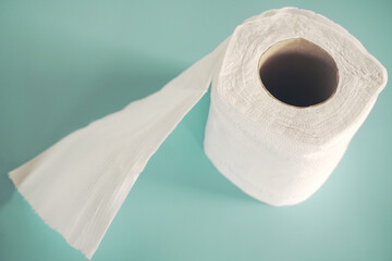 Simple toilet paper on blue background.