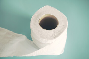 Simple toilet paper on blue background.