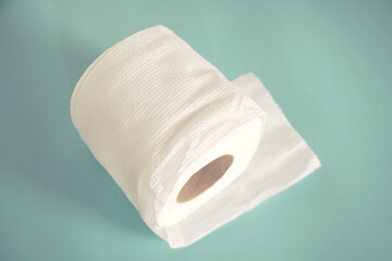 Simple toilet paper on blue background.