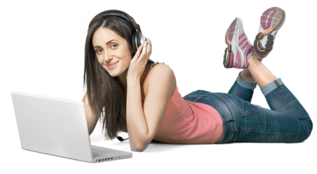 Young woman lying down in front of a laptop wearing headphones