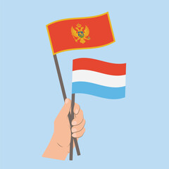 Flags of Montenegro and Luxembourg, Hand Holding flags