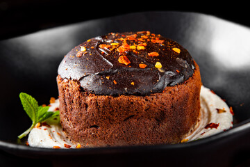 Basque cheesecake with Chocolate and cream in bowl