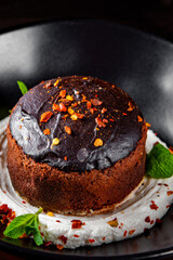 Basque cheesecake with Chocolate and cream in bowl