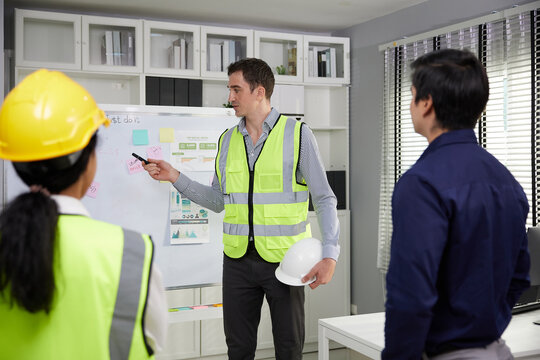 engineer meeting and talking about work or project on whiteboard in the office