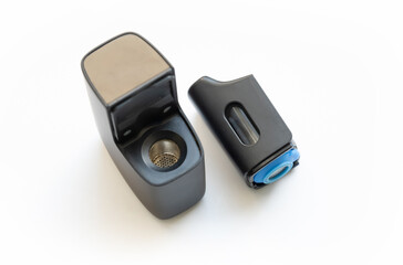 Open recently used herb vaporizer device, vaporizing herbs, marijuana, cannabis, herbal therapy, alternative holistic medicine methods, equipment Recreational drugs technology, object on white, nobody