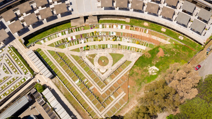 Aerial view of the municipal cemetery of Pomezia, in the Metropolitan City of Rome, Italy. Buried people. Tombs and memorial chapels.