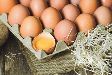 Freshly picked chicken eggs on a rustic background © Jan Kravа