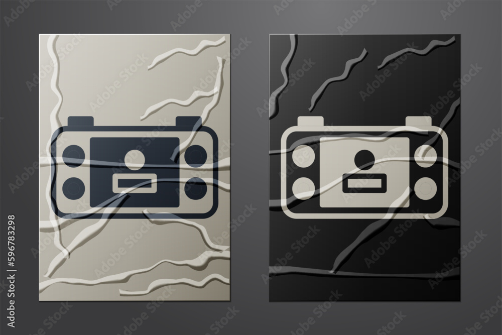 Poster white portable video game console icon isolated on crumpled paper background. handheld console gamin
