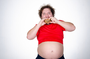 Diet and healthy lifestyle. Funny fat man eating a burger.