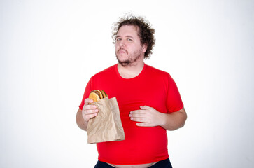 Diet and healthy lifestyle. Funny fat man eating a burger.