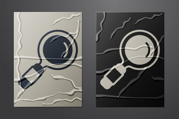 White Magnifying glass icon isolated on crumpled paper background. Search, focus, zoom, business symbol. Paper art style. Vector