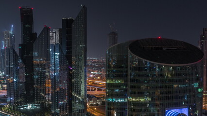 Dubai international financial center skyscrapers aerial all night timelapse.
