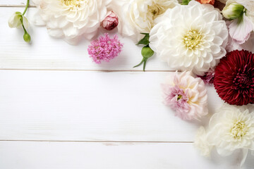 A white wood background topped with lots of beautiful white, pink and violet flowers , blank space and text space. Abstract natural floral layout with text space and copy space. Wedding invitation. In