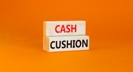 Cash cushion symbol. Concept words Cash cushion on beautiful wooden block. Beautiful orange table orange background. Business and Cash cushion concept. Copy space.