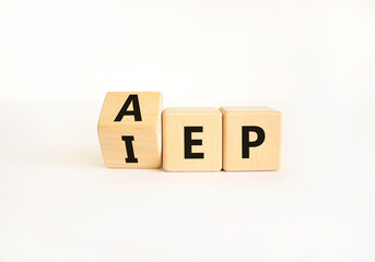 AEP or IEP symbol. Concept words AEP annual enrollment period IEP initial enrollment period. Beautiful white table white background. Medical annual or inintial enrollment period concept. Copy space.