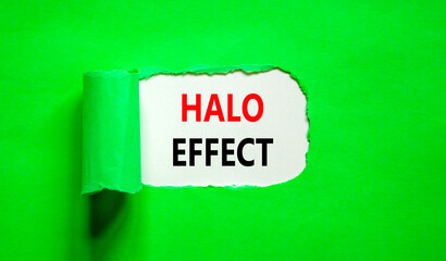Halo effect and psychological symbol. Concept words Halo effect on beautiful white paper. Beautiful green table green background. Business psychological and Halo effect concept. Copy space.
