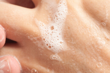 Fototapeta premium Washing men's hands with soap. Personal hygiene concept, hand washing.
