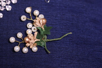 artificial decorative flowers and pearls used by beauticians for bridal hair do.