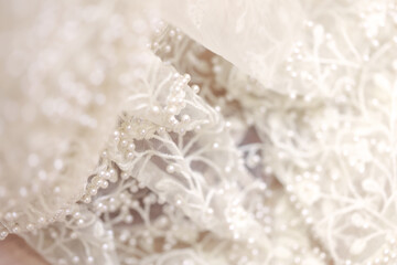 Wedding concept Close up of detail on wedding gown