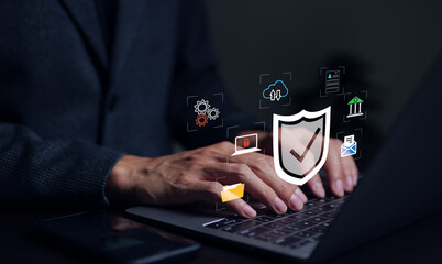 Cybersecurity and privacy concepts to protect data. Protective shield icon and internet network security technology. Businessman protecting personal data on computer, virtual screen interfaces.