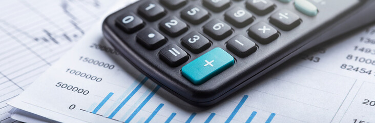 calculator and accounting document. Concept of banking, financial report and financial audit.