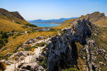 View of the harbour of Port de Pollença, a seaside village located on the northern coast of Mallorca from a mountaintop in the Balearic Islands, Spain