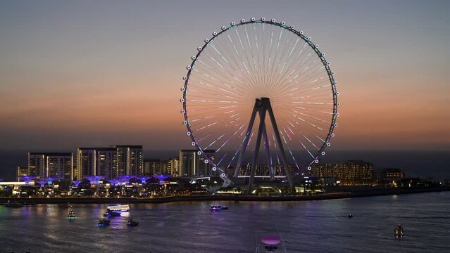Spiral lights on structure of Ain Dubai Observation Wheel on BlueWaters Island at sunset