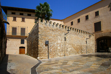 Stone wall in the courtyard of the Arab baths of Palma of Mallorca - Ancient moorish bath house located in the Balearic Islands, Spain