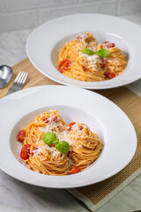 spaghetti with tomatoes, basil and parmesan cheese