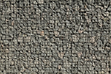 Gabion, texture, background. Gabion net and construction design. New technologies in arranging terraces on a personal plot. Modern decorative elements of landscape design