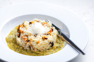 risotto with mussels, sauce and parmesan cheese