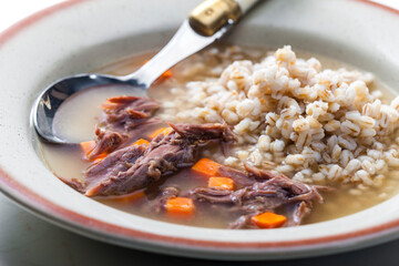 beef broth with carrot and barley groats