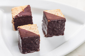 Fototapeta na wymiar nutty sponge cakes with chocolate coating