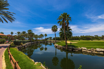 Fototapeta premium Beautiful view of lake and green golf courses on island of Aruba.