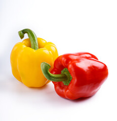 red and yellow peppers isolated on white