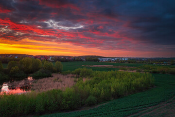 Amazing sunset over the spring fields of Rotmanka, Poland