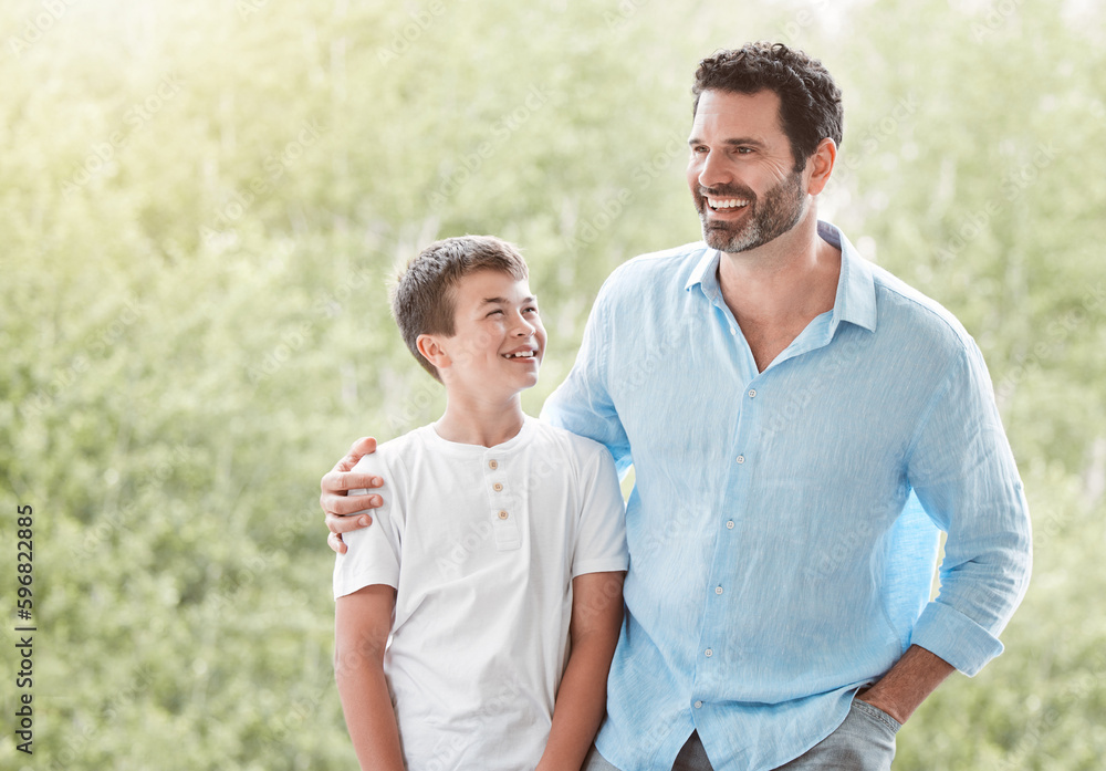 Wall mural Hes my role model. Shot of a father and son spending time together outside in the garden at home.