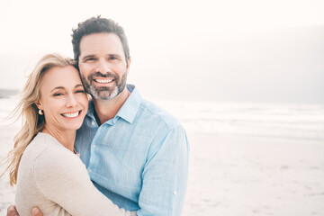 Obraz premium Howd I get so lucky. Shot of a mature couple spending a day at the beach.