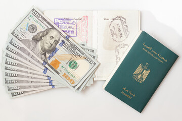 Egyptian Passport, Isolated on White Background, Arabic Text "Arab Republic of Egypt Passport" with one hundred US banknotes